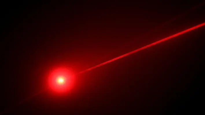 a red laser beam on a black background