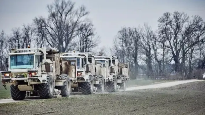 vibroseis_vehicles_operating_on_paved roads